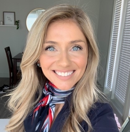 Woman with long, blonde hair smiling